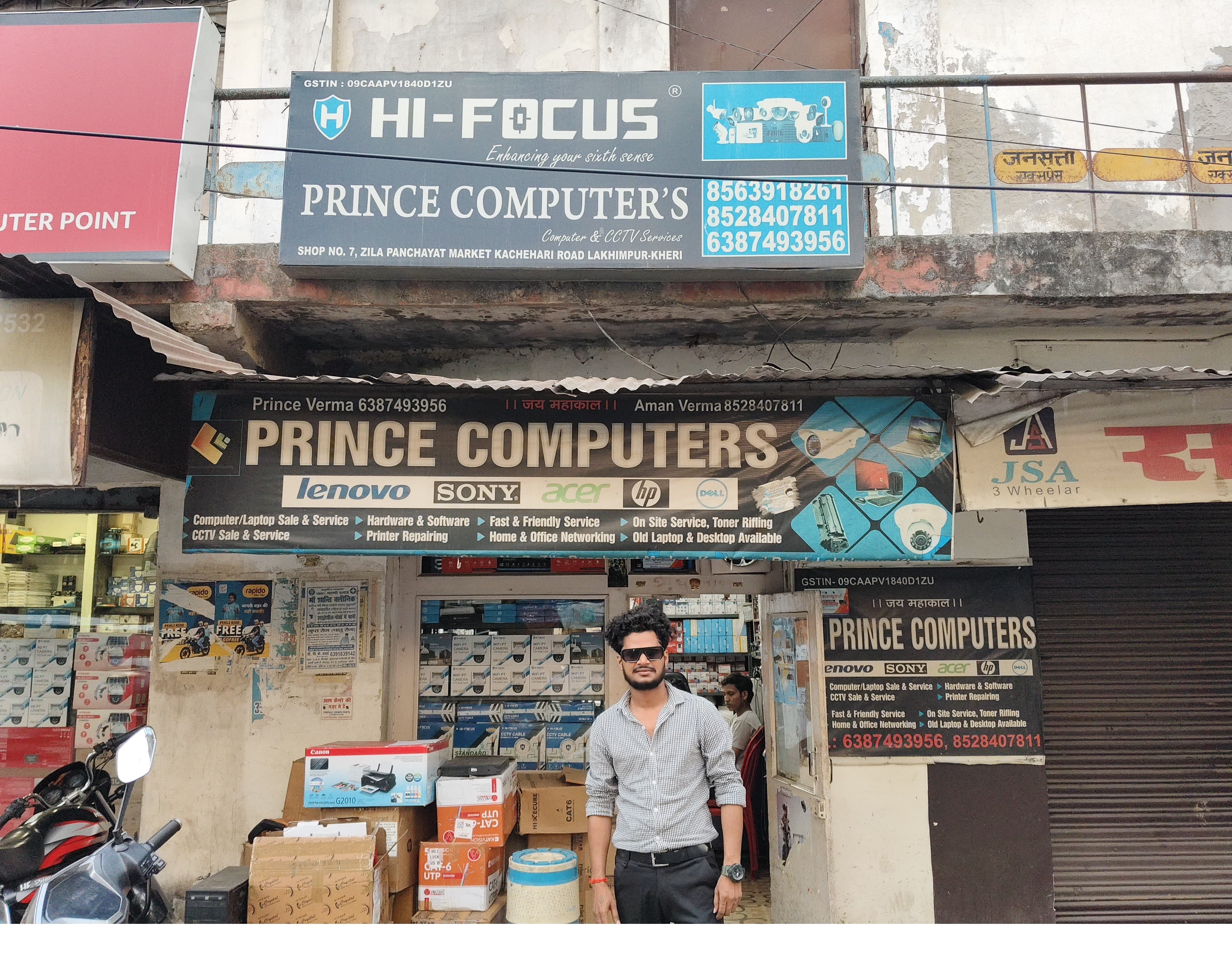 Prince Computer's shopfront with Prince Verma standing outside, Zila Panchayat Market, Lakhimpur Kheri
